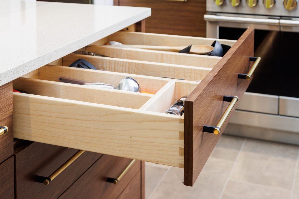 A kitchen drawer with a utensil organizer is one of the many cabinet accessories built by Miller Cabinetry.